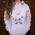 Model wearing Maestro (keys wizard) graphic hoodie from Cryptid Records in pink